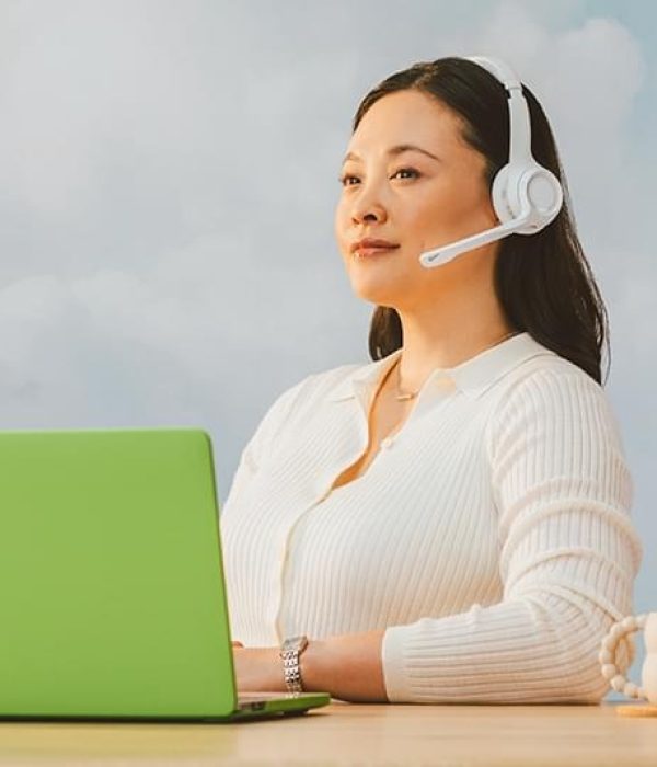 heroimageofcallcentercustomerservicerepresentativesitsinfrontofalaptop heroimageofcallcentercustomerservicerepresentativesitsinfrontofalaptop
